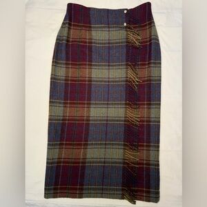 Vintage Lauren Ralph Lauren multicolor plaid wool wrap skirt with fringe detail.